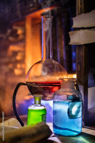 Medieval Alchemist Laboratory With Various Kind Of Flasks In