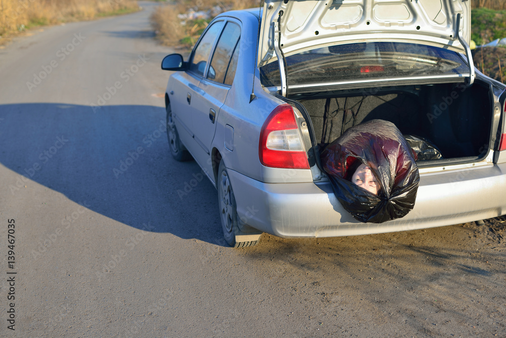 The corpse of a girl in a car trunk Stock Photo | Adobe Stock