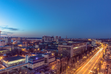 Night Voronezh city after sunset, blue hour, night lights of houses, buildings, 