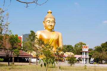 Outdoor view Golden buddha statue place of worship