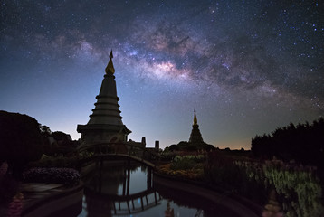 Wall Mural - milky way with two pagoda in chiang mai