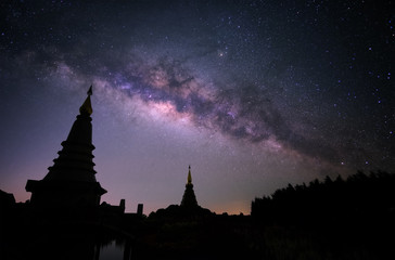 Wall Mural - milky way with two pagoda in chiang mai