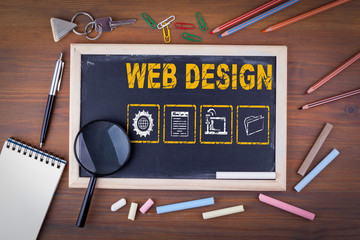 Sticker - web design concept. on a wooden table chalk board.