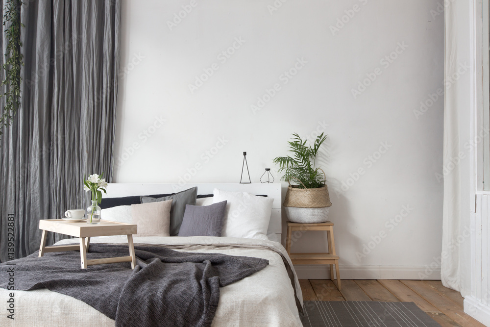 Interior of white and gray cozy bedroom - obrazy, fototapety, plakaty 