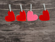 four  hearts hanging on a cord 