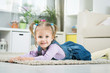 © Evgenia Tiplyashina - two years old baby lies on the floor