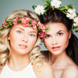 © artmim - Beautiful Blonde and Brunette Models. Fashion Beauty Portrait of Nice Women with Flowers