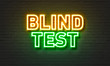 © ibreakstock - Blind test neon sign on brick wall background.