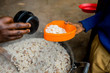 © sadokhinstas - lunch at african school. Hands of woman while feed a children with porridge and beans