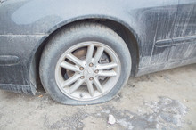 Russia, Saint-Petersburg, February 16, 2017 - Dirty Mercedes With A Broken Wheel.
