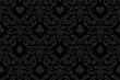 Seamless black background with poker symbols surrounded by floral ornament pattern