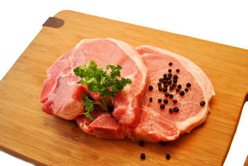 Fresh Lean Pork Chops on a Cutting Board 