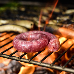 Wall Mural - grilling a pork meat sausage