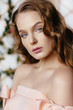 © irinaneva - Portrait of a beautiful fashion, sweet and sensual. make up and hair. Perfect Skin. Flowers background. Art modern style. Blue eyes. Natural manicure.