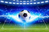 Fototapeta Sport - Soccer ball, bright blue lightning, green football field with layout