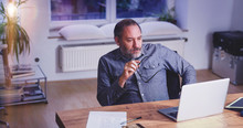 Grey Bearded Mature Man Creative Director Sitting In Modern Office