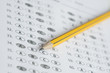 © Have a nice day  - A pencil sitting on a test bubble sheet, optical form of an examination,Answer sheet with pencil,Standardized test form with answers bubbled and a black pencil,selective focus,vintage color