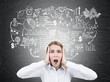 © ImageFlow - Stressed woman and business sketch, blackboard