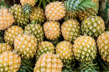 sweet Thai pineapples lie on a counter