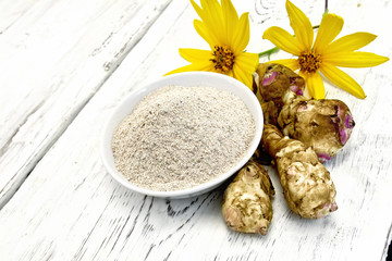 Poster - Flour of Jerusalem artichoke in bowl with vegetables on light  board