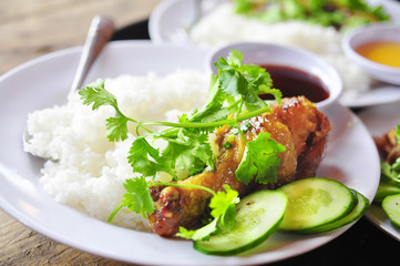 Wall Mural - Vietnamese broken rice or com tam with fried chicken legs, pork and herbs