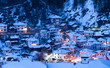 Snowy fairytale in Bulgaria. Night goes down over Shiroka Laka village, Bulgaria