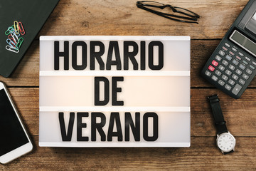 Sticker - Horario de Verano, Spanish Horario de Verao, Portuguese Daylight Saving Time in vintage style light box on office deskt op