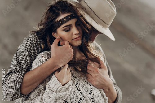 Handsome Cowboy Man In White Hat Touching Cheek Of Beautiful Boho
