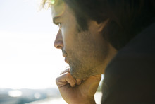 Man Looking Away In Thought, Hand Under Chin