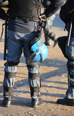 Wall Mural - police in riot gear with protective helmet waiting for the fans