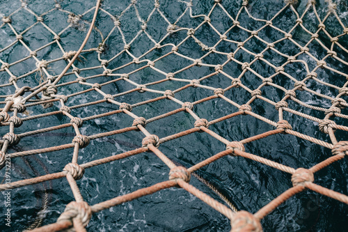 Fotografía Old fishing net in the sea water