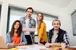 © W PRODUCTION - group of young cool hipster business people in casual wear working together in meeting room of a startup company