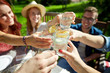 © Syda Productions - happy friends with drinks at summer garden party
