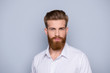 © deagreez - Portrait of confident bearded man in white shirt