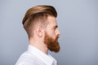 © deagreez - Side view portrait of confident bearded man with beautiful hairstyle   in white shirt looking on copy space