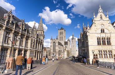 Canvas Print - GENT, BELGIUM - MARCH 2015: Tourists visit ancient medieval city. Gent attracts more than 1 million people annually