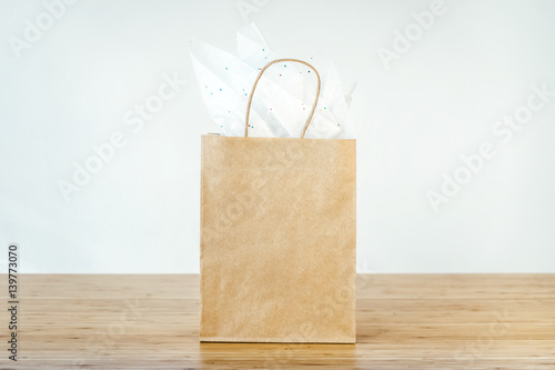 Download Free Mock Up Of Blank Craft Package Mockup Of Brown Paper Shopping Bag With Handles On The White Background Front View Buy This Stock Photo And Explore Similar Images At Adobe Stock PSD Mockups.