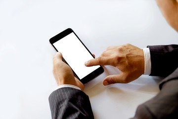 Businessman using Smartphone. Blank screen smartphone in business hands.