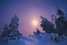 Winter Mountain Hills And Forest In Night Time With Big Moon On Blue Sky