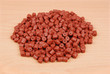 Red pre-drilled halibut pellets
