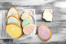 Beautiful Glazed Easter Cookies On Wooden Table