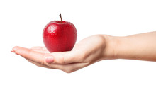 Beautiful Female Manicured Hand Holding A Perfect Red Apple With Water Drops Isolated