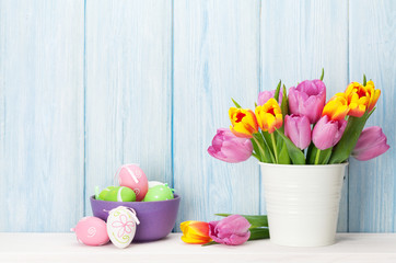 Easter eggs and colorful tulips bouquet