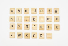 Lowercase Alphabet Letters On Scrabble Wooden Blocks, Isolated On White Background