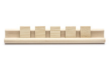 Five Blank Scrabble Tiles On A Wooden Rack, On White Background
