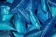 Leinwandbild Motiv Wet Fresh tropical blue leaves background