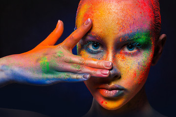 Wall Mural - Model with colorful art make-up, close-up