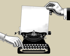 Hands of man and woman with old typewriter