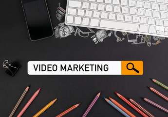 Canvas Print - video marketing concept. colorful pencils and a computer keyboard with a mobile phone on a black table.