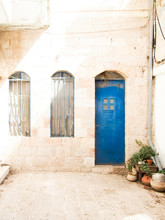 Blue Door In White Stone Building